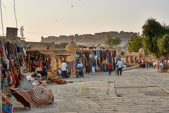 local souvenir shops at Ghat of Gadisar Lake with rampart of Jaisalmer in the back