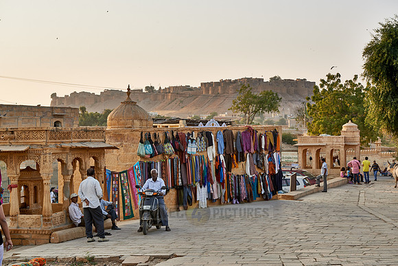 local souvenir shops at Ghat of Gadisar Lake with rampart of Jaisalmer in the back