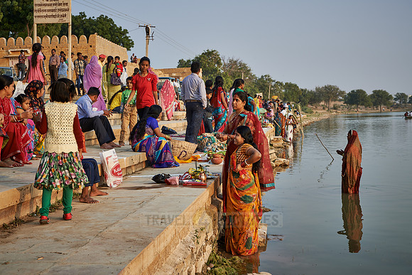 colorful dressed women celebrating ceremony at Ghat