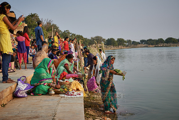 colorful dressed women celebrating ceremony at Ghat