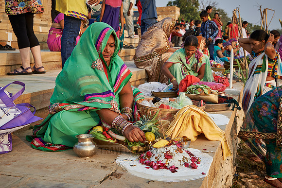 colorful dressed women celebrating ceremony at Ghat