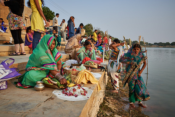 colorful dressed women celebrating ceremony at Ghat