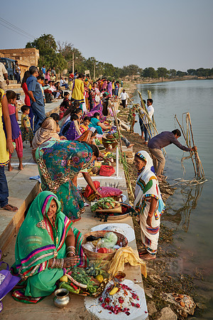 colorful dressed women celebrating ceremony at Ghat