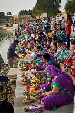 colorful dressed women celebrating ceremony at Ghat