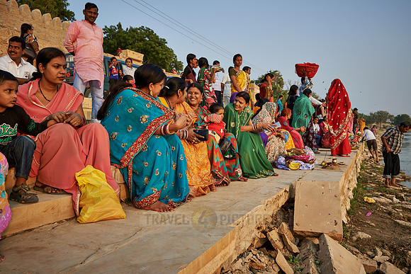 colorful dressed women celebrating ceremony at Ghat