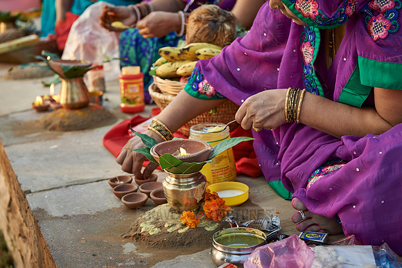 colorful dressed women celebrating ceremony at Ghat
