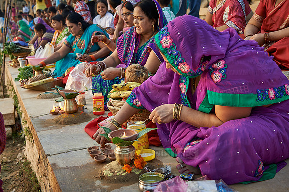 colorful dressed women celebrating ceremony at Ghat