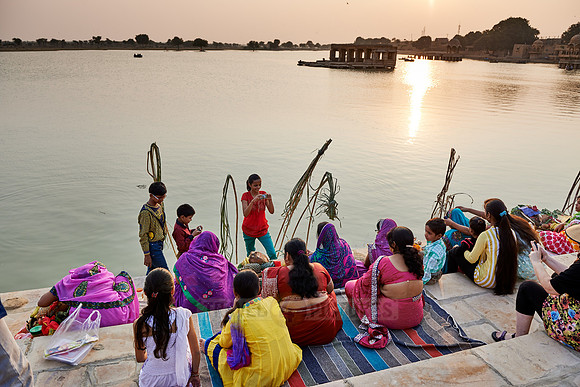 colorful dressed women celebrating ceremony at Ghat