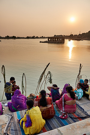 colorful dressed women celebrating ceremony at Ghat