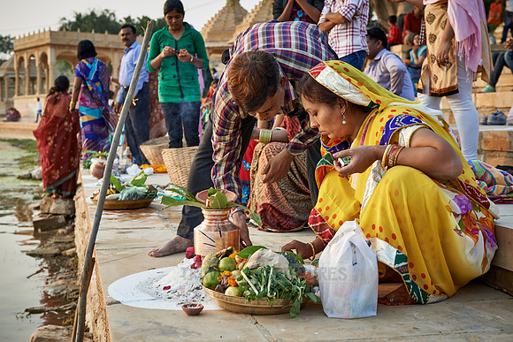 colorful dressed women celebrating ceremony at Ghat