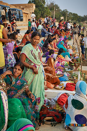 colorful dressed women celebrating ceremony at Ghat