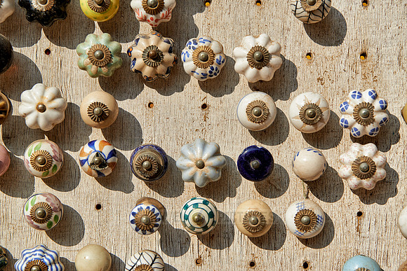many different knobs and handles on market stall
