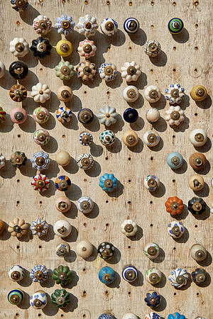 many different knobs and handles on market stall