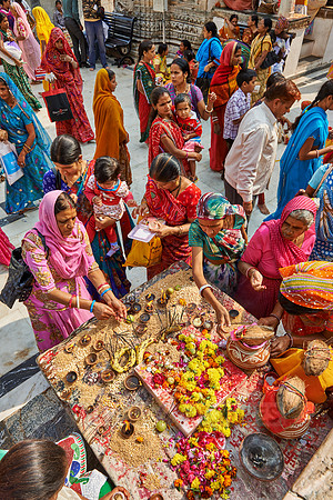indian women with colorful clothes during ceremony inside Jagdish Temple