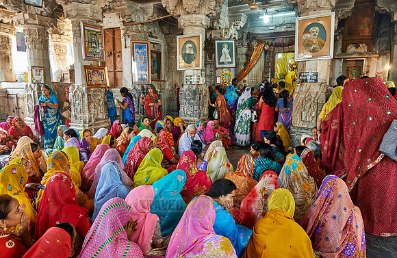 indian women with colorful clothes during ceremony inside Jagdish Temple