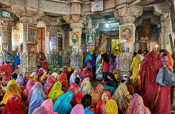indian women with colorful clothes during ceremony inside Jagdish Temple