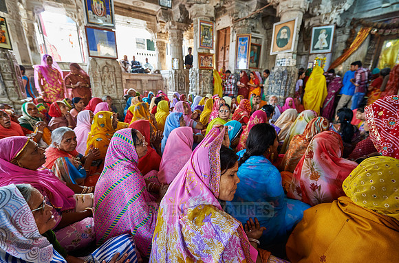 indian women with colorful clothes during ceremony inside Jagdish Temple