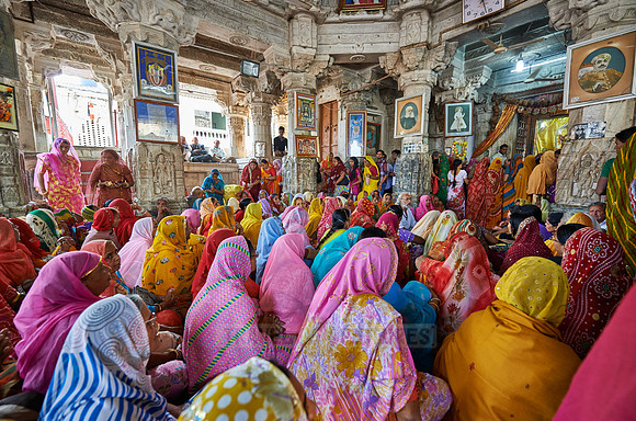 indian women with colorful clothes during ceremony inside Jagdish Temple