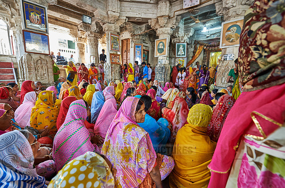 indian women with colorful clothes during ceremony inside Jagdish Temple