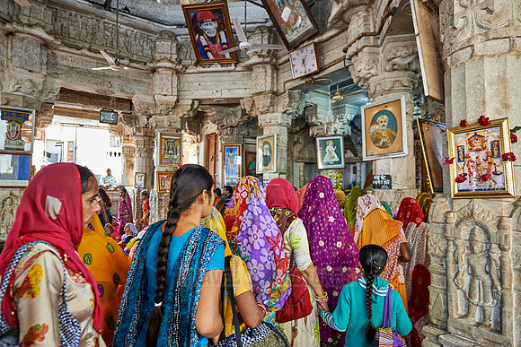 indian women with colorful clothes during ceremony inside Jagdish Temple