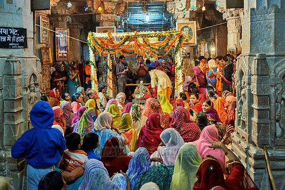 indian women with colorful clothes during ceremony inside Jagdish Temple