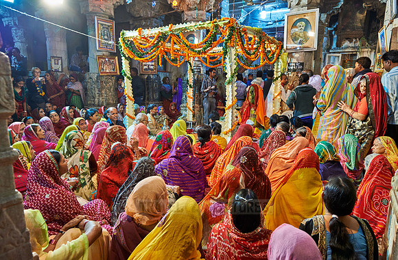 indian women with colorful clothes during ceremony inside Jagdish Temple