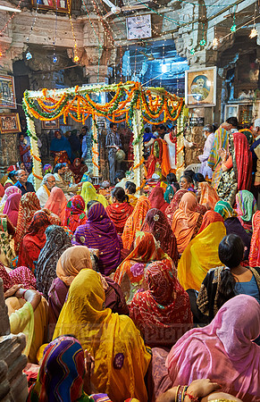 indian women with colorful clothes during ceremony inside Jagdish Temple