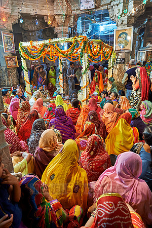 indian women with colorful clothes during ceremony inside Jagdish Temple