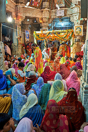 indian women with colorful clothes during ceremony inside Jagdish Temple