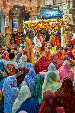 indian women with colorful clothes during ceremony inside Jagdish Temple