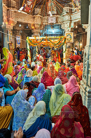 indian women with colorful clothes during ceremony inside Jagdish Temple