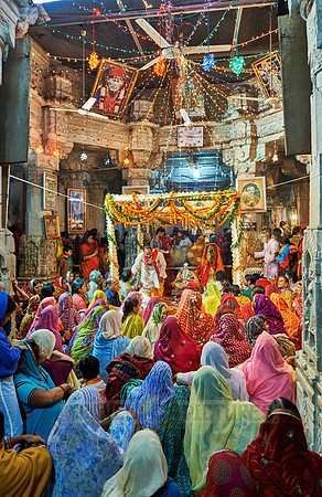 indian women with colorful clothes during ceremony inside Jagdish Temple