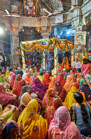 indian women with colorful clothes during ceremony inside Jagdish Temple