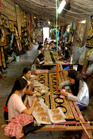 women stitching tapestries