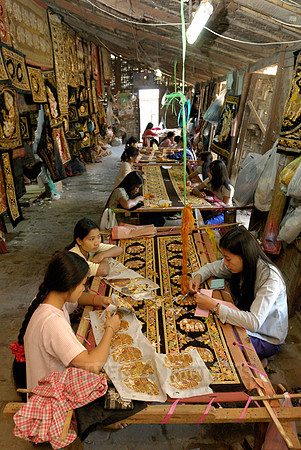 women stitching tapestries