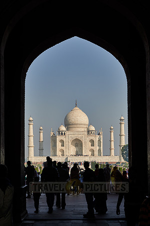 Tourists walking thru The Great Gate to Taj Mahal