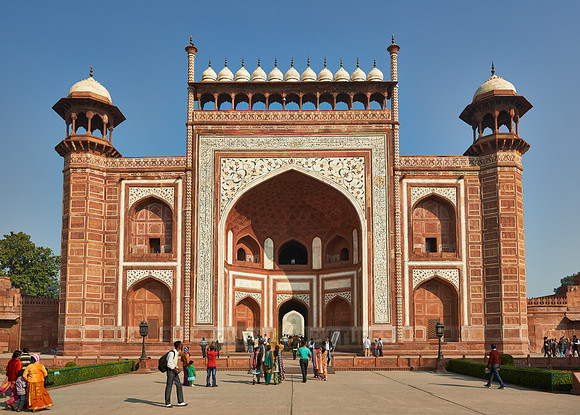 Tourists walking thru The Great Gate to Taj Mahal