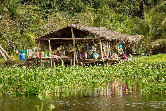 native people in wooden house on stilts of Warao indians