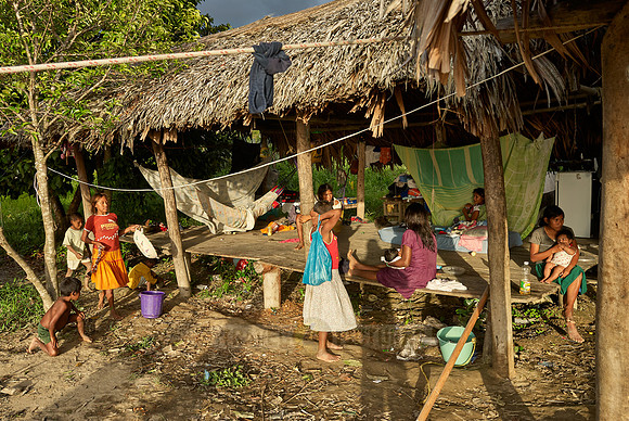 native people in wooden house on stilts of Warao indians