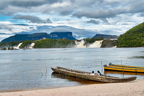 boats in front of waterfalls in lagoon of Canaima