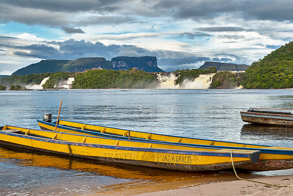 boats in front of waterfalls in lagoon of Canaima