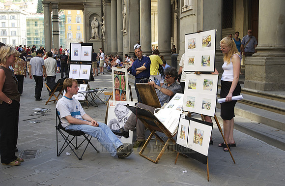 Street artist, painter with tourist at the Uffizi Galleries