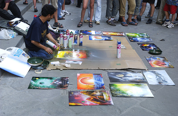 Street artist, painter with tourist at the Uffizi Galleries