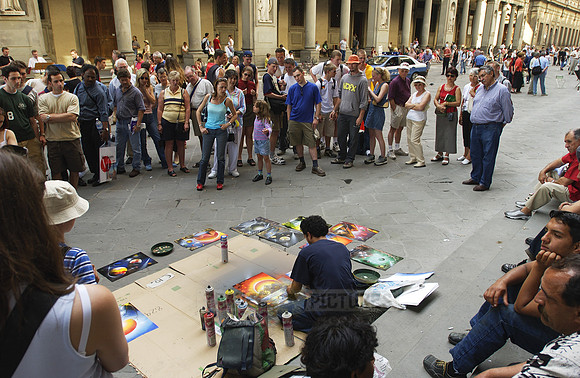 Street artist, painter with tourist at the Uffizi Galleries