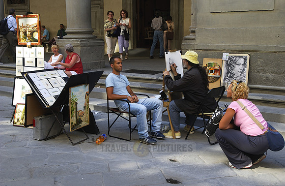 Street artist, painter with tourist at the Uffizi Galleries