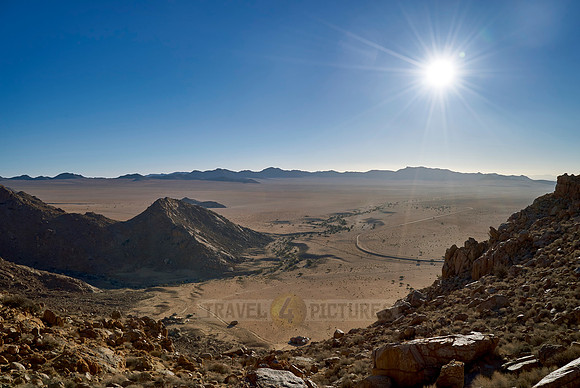 view from mountain on desert landscape with burning sun of farm Klein-Aus Vista