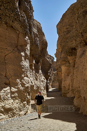 man is walking thru Sesriem canyon