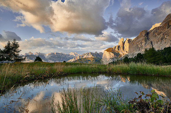 Sella group is reflected in a small lake