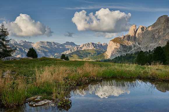 Sella group is reflected in a small lake