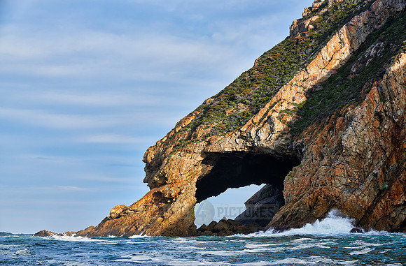 cliffs and cave at coastline